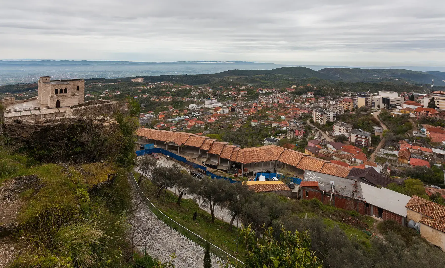 The bazaar roofs and the plain beyond
