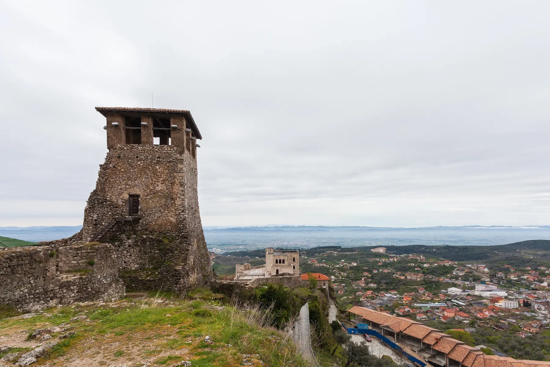 The old tower of Kruja Castle above the town, with the plain stretching towards the coast, Albania