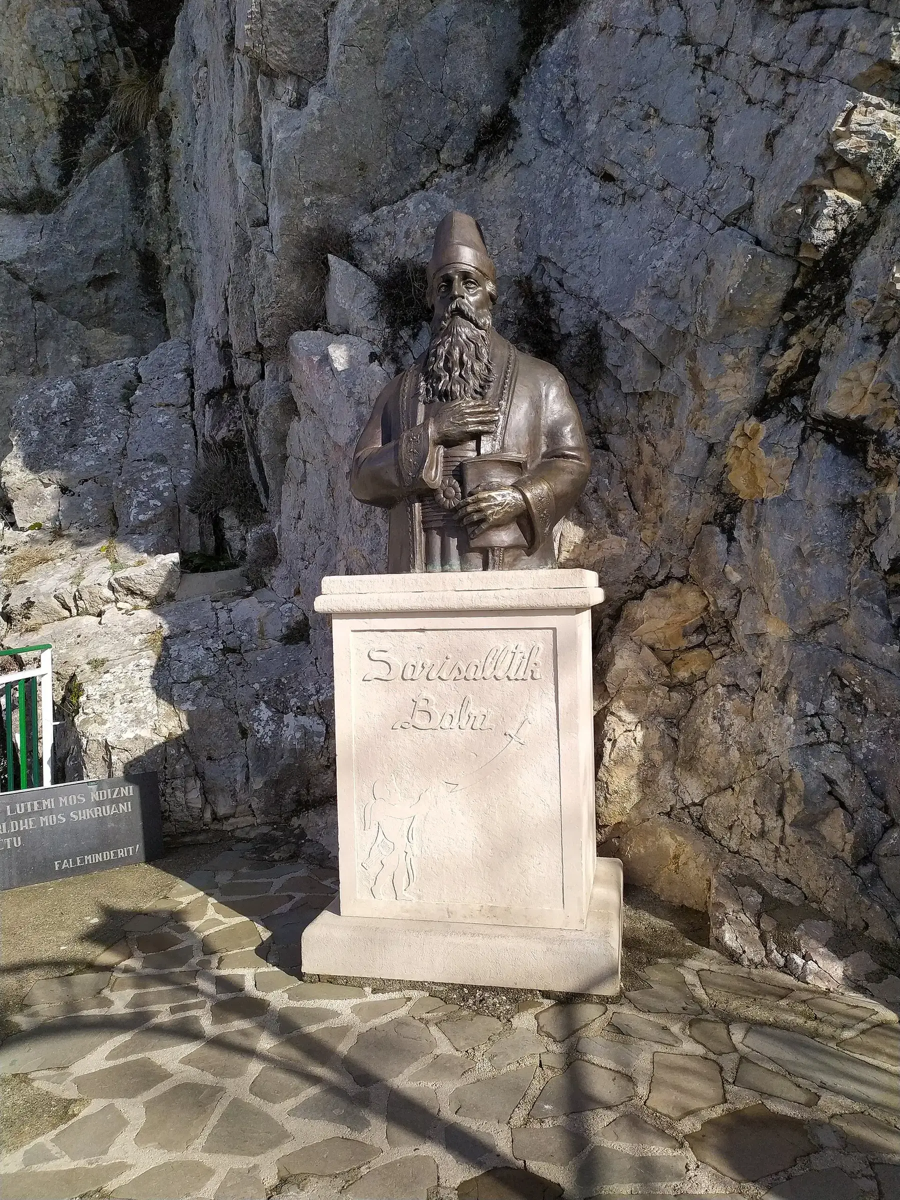Bust of Sari Salltik by the cave