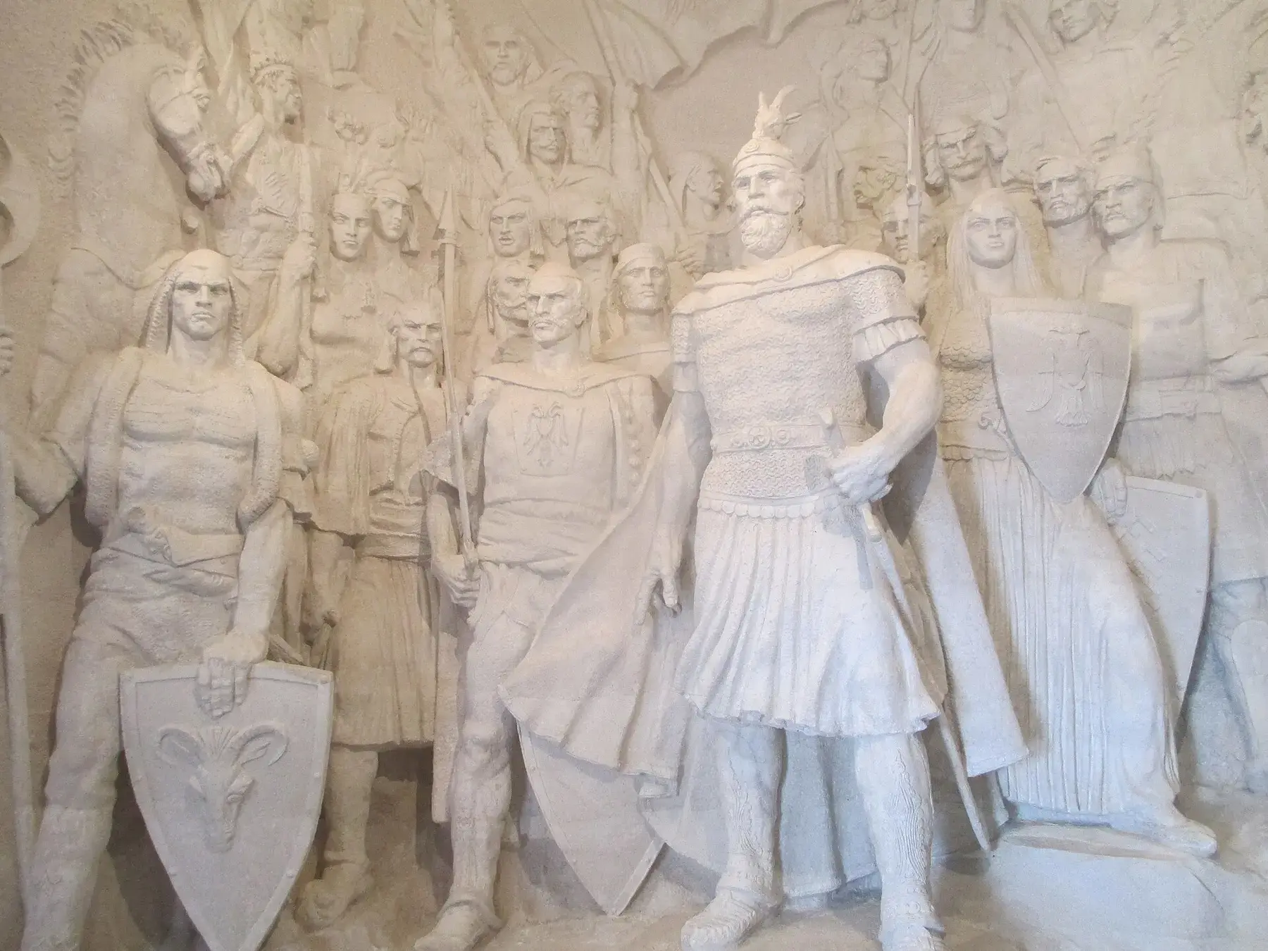 Skanderbeg and his warriors in stone